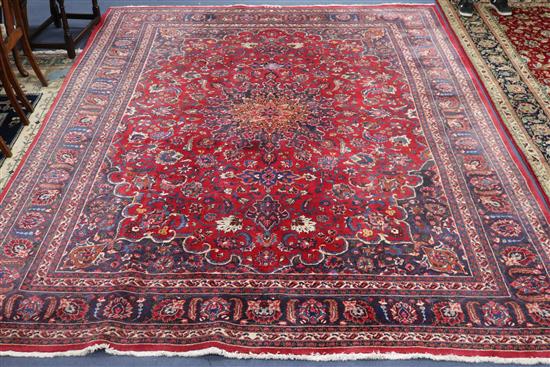 A Tabriz red ground carpet, 292 x 380cm